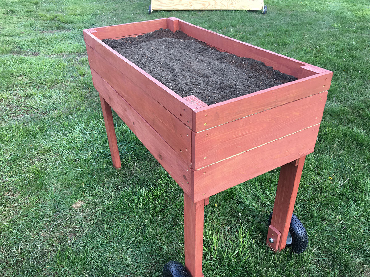 Raised planter with wheels